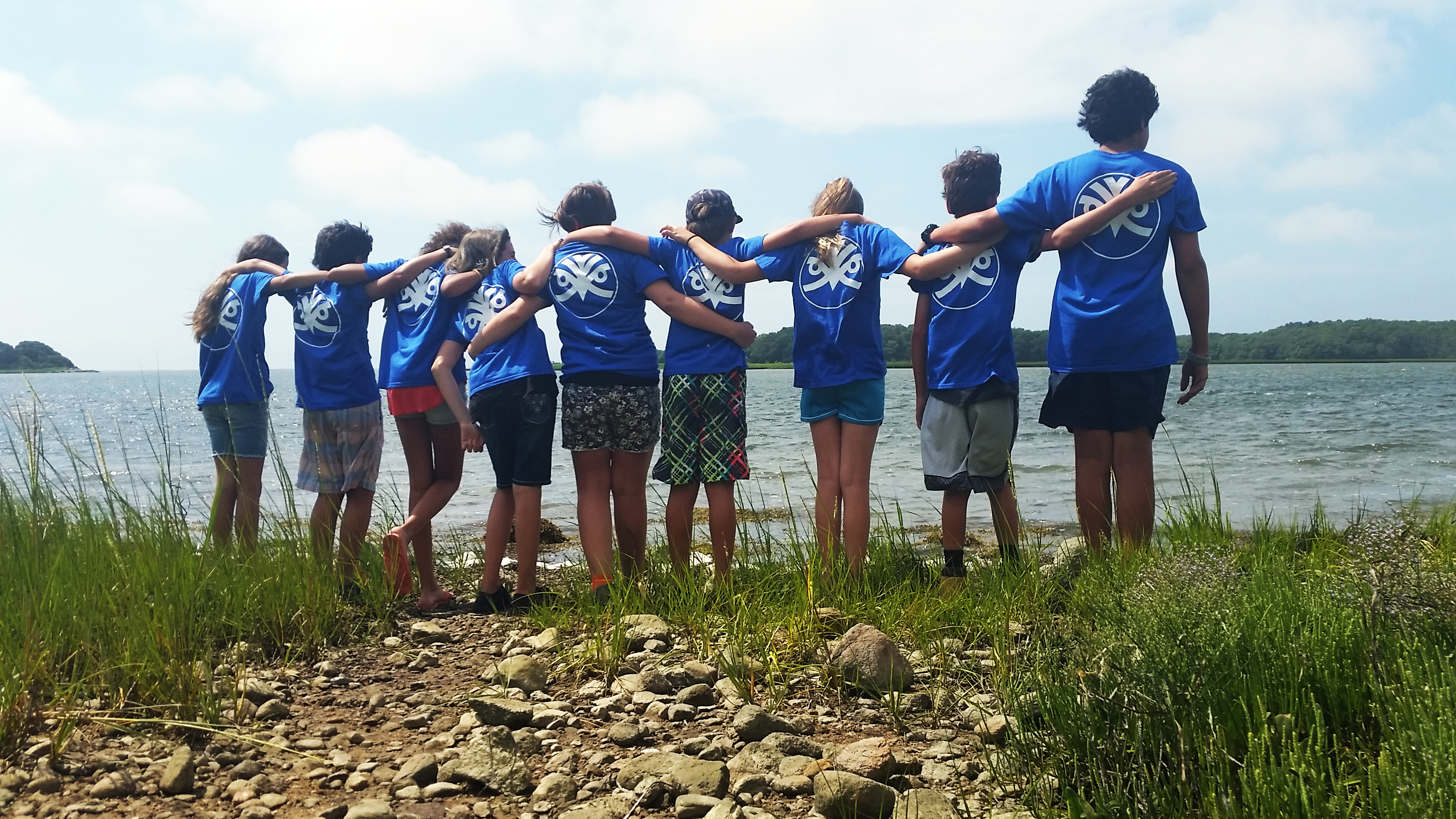 Group of students look out at an estuary