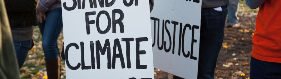 stand up for climate and climate justice signs