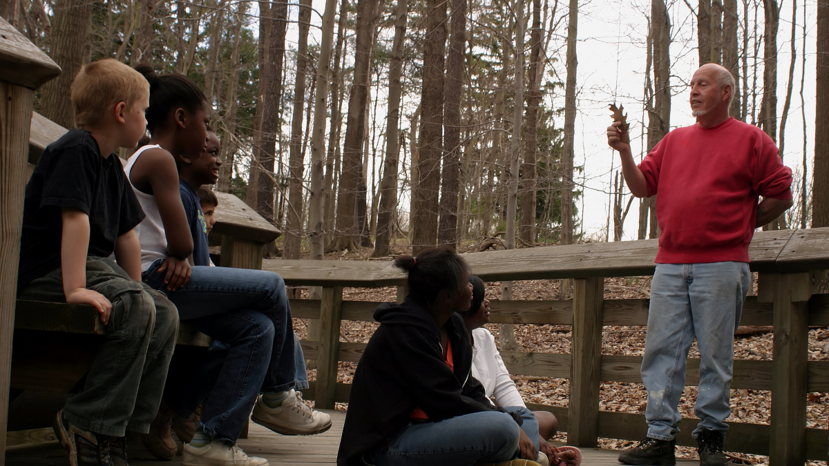 Teacher and students outdoors