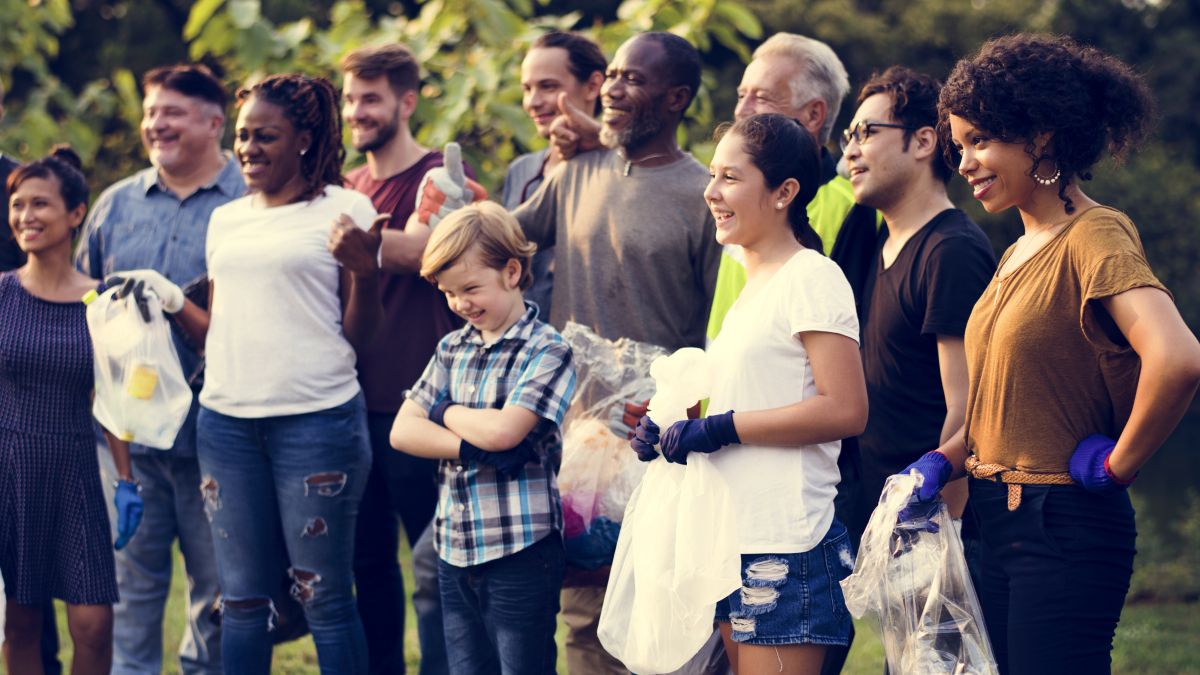 people working together to clean up community