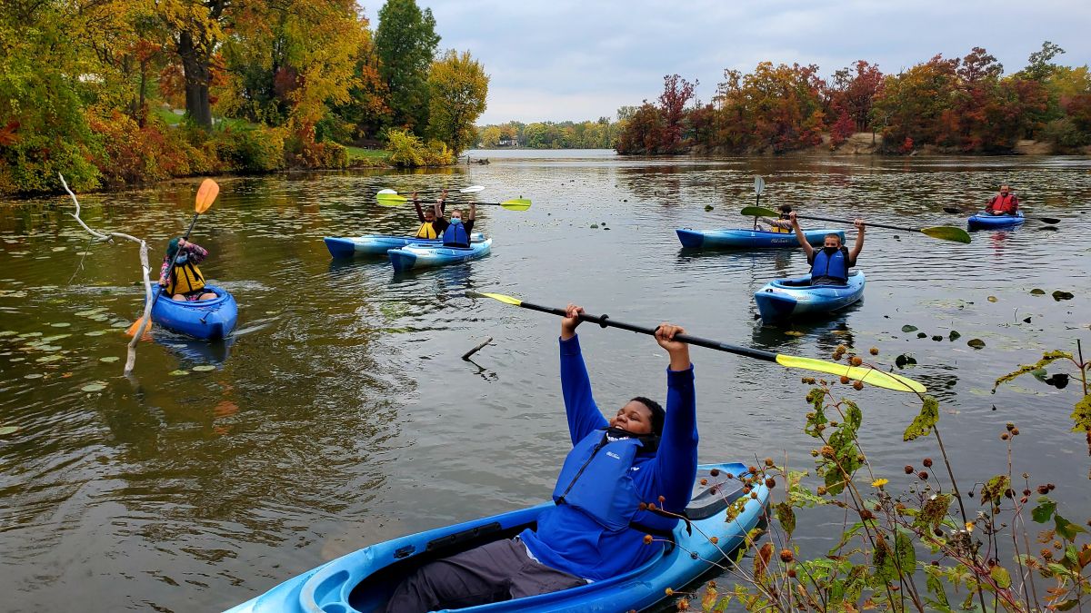 Students kayaking on river
