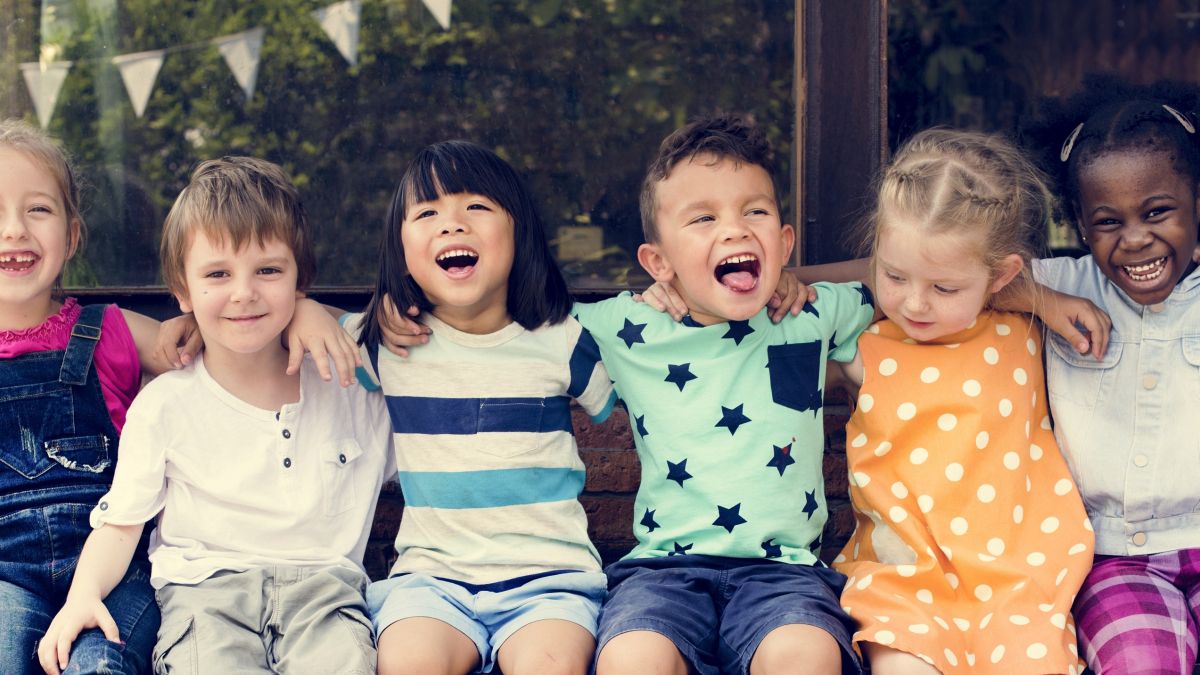 young children sitting on bench v2