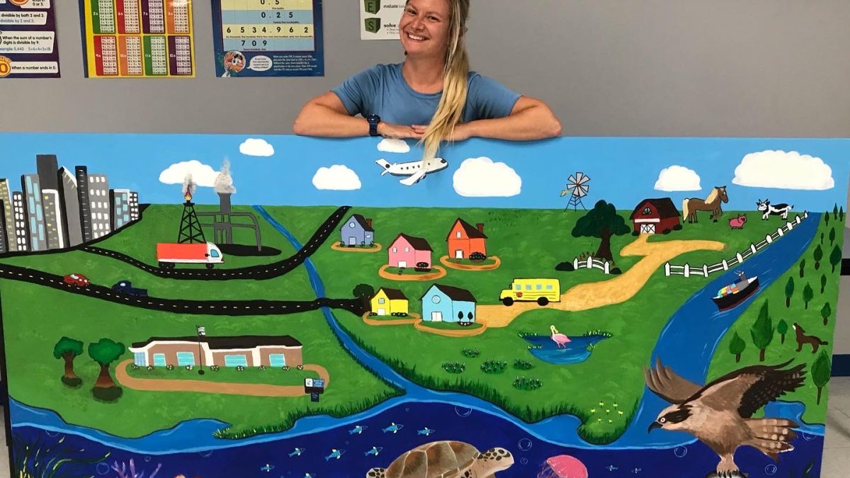 Colorful mural of a town and watershed.