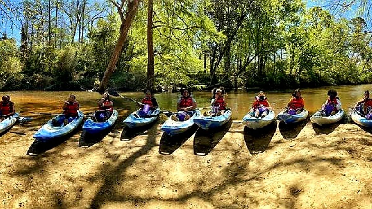 ReNEW Schaumburg Elementary middle school 21CCLC students pause at a sandbar on a kayak trip to test for pollutants at the Bogue Falaya. Photo credit: Matt May.