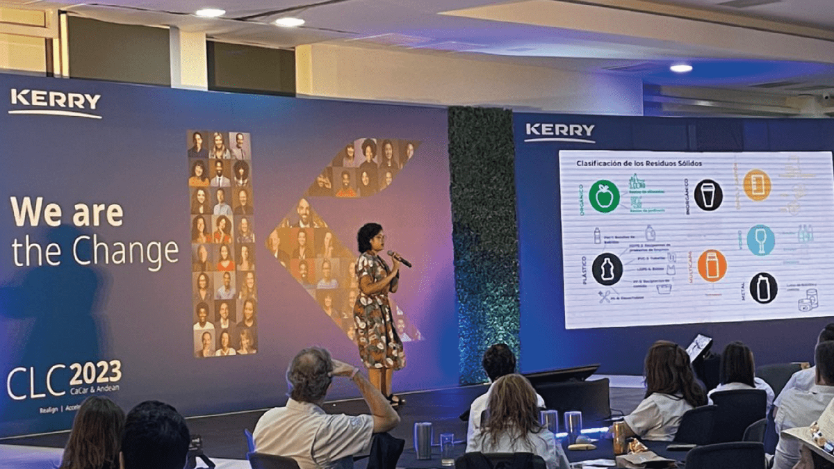 A young woman speaking on stage