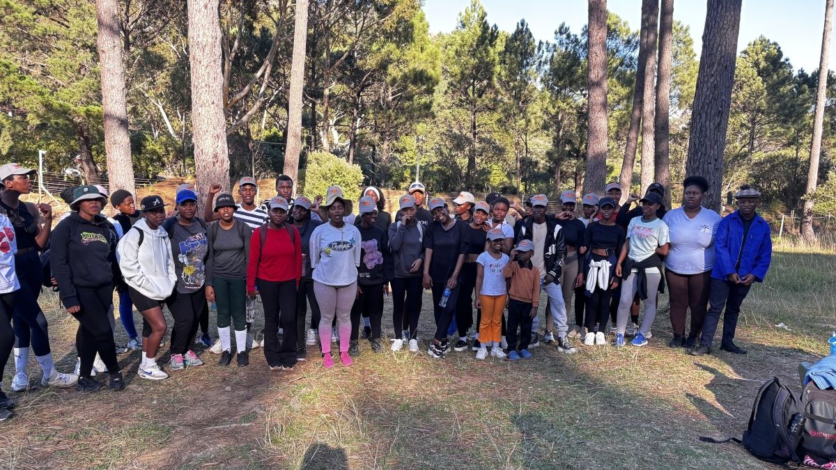 A large group of people outside after a hike.