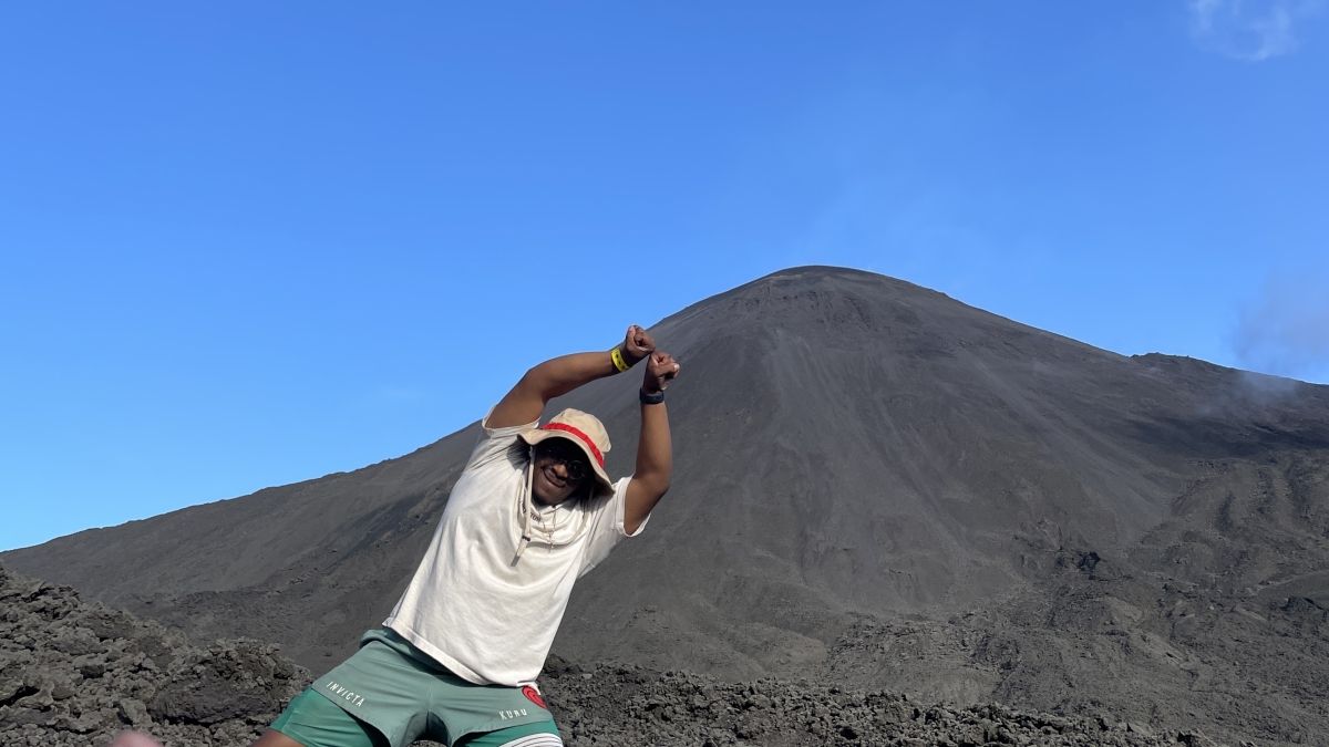 Person in front of a mountain