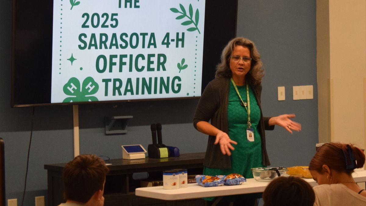 Sarah leading a 4-H Officer training inside a classroom
