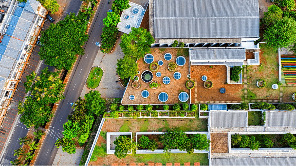 Aerial view of school surrounded by gardens