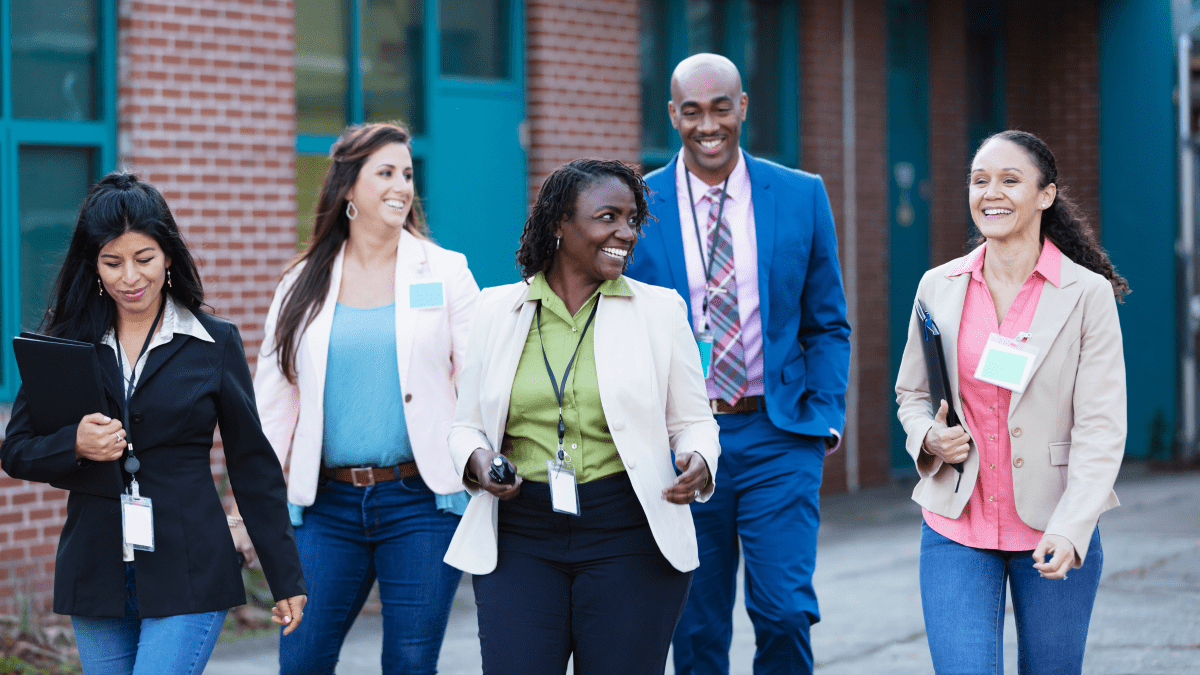 Group of teachers walk outside