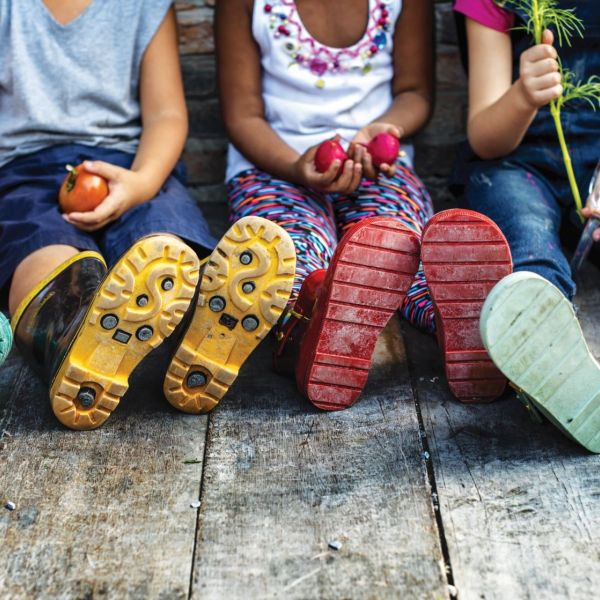 NS Guidebook cover children sitting on wood deck with colorful rain boots