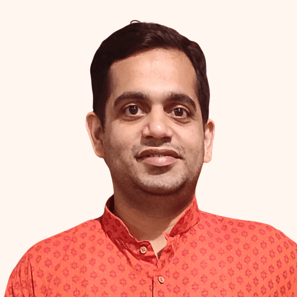 Headshot of Avadhut in a red shirt