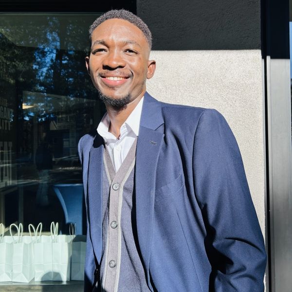 Caleb wearing a suit jacket