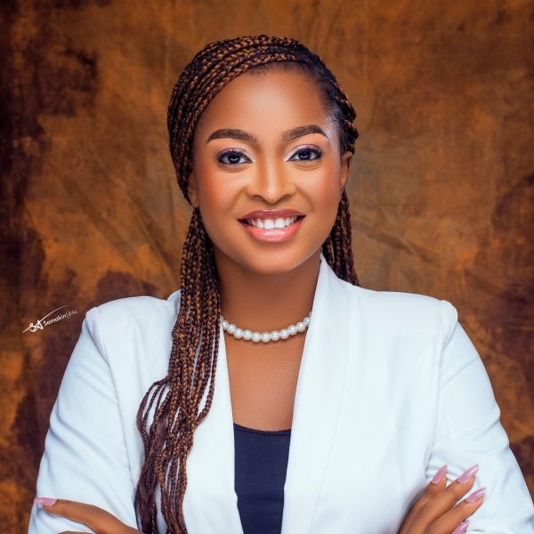 Favour in a white suit jacket