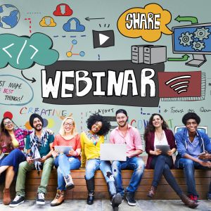 7 people sitting on bench with 'webinar' written on wall behind them