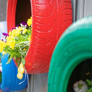 Colorful tires turned into flower planters
