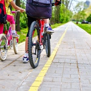 children cycling on yellow bike lane