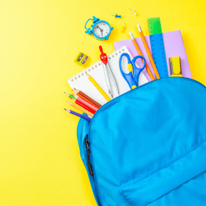 Blue backpack spills out penciles, notebooks