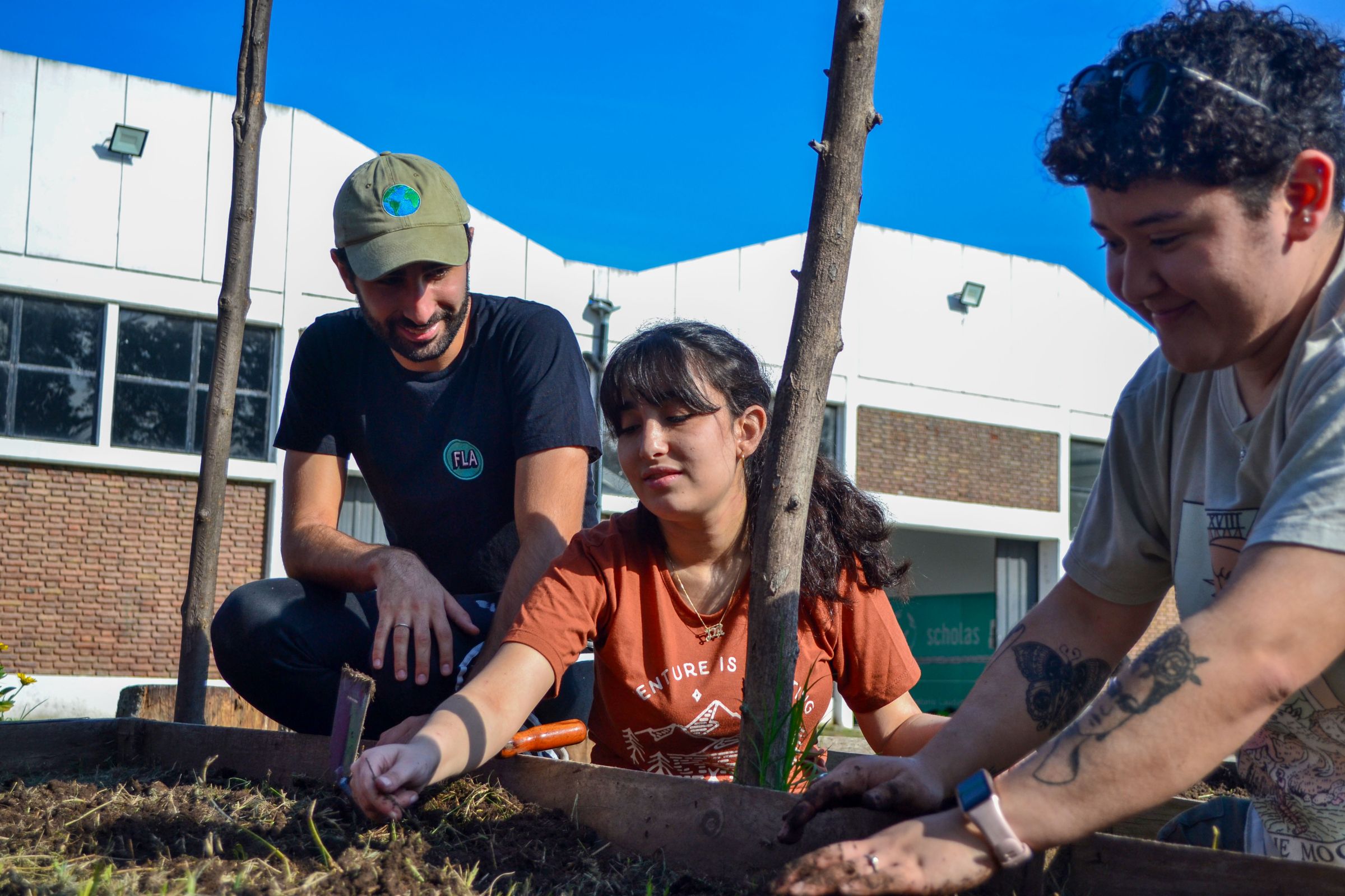 Tomas at an orchard restoration day with young people. Credit: Consciente Colectivo. 