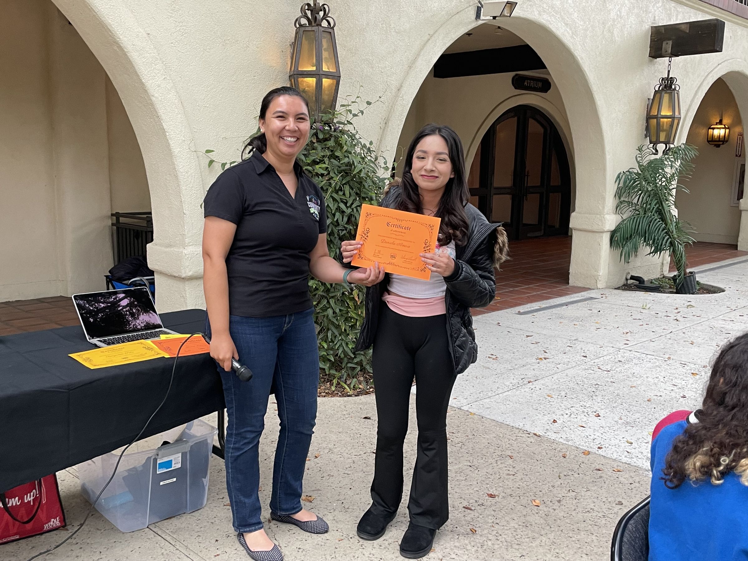 Jenna and an Emerging Naturalist celebrate her completion of the program.