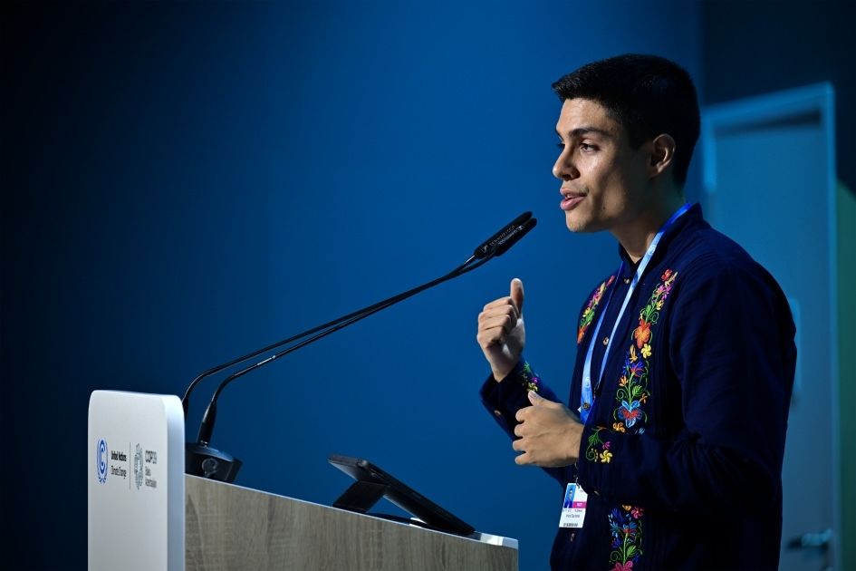Man speaking at a podium