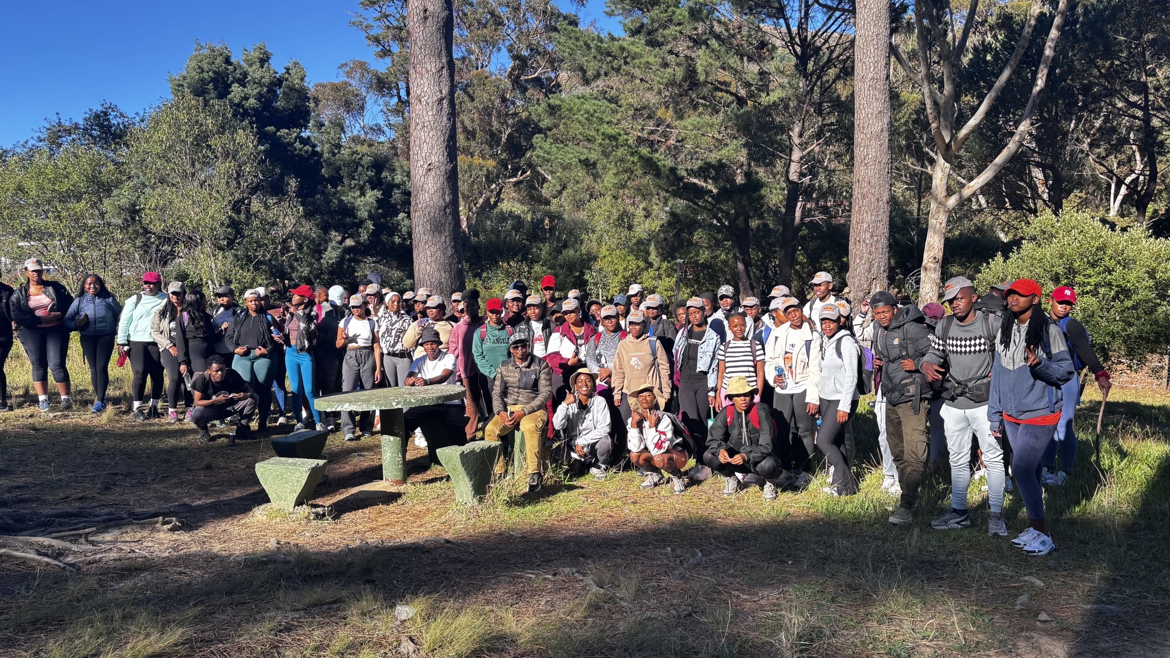 A large group of people out in nature.