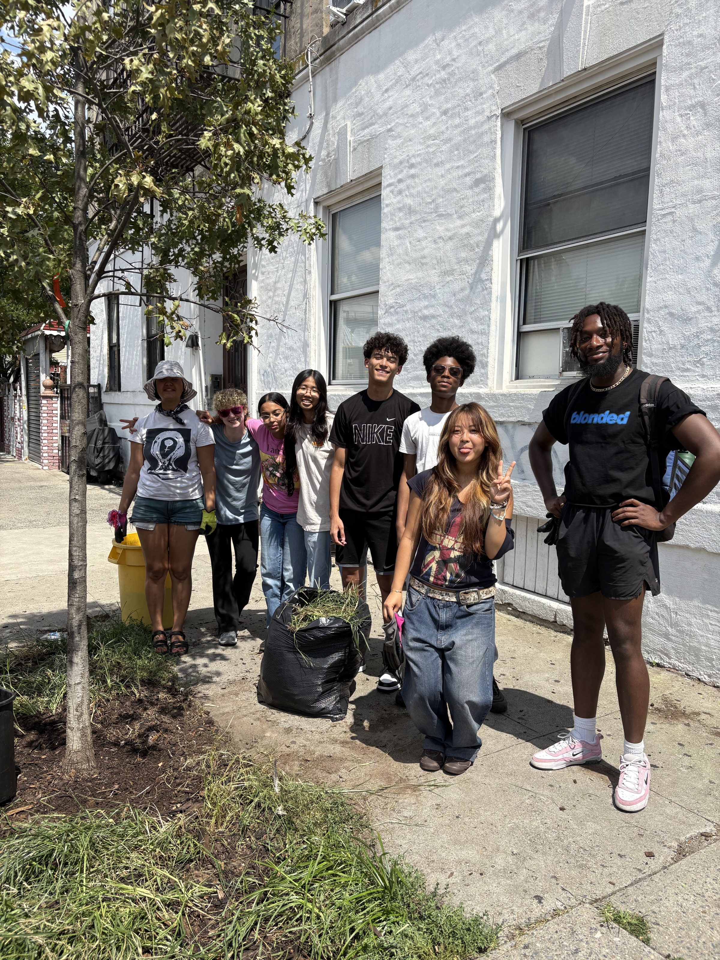 EE 30 Under 30 Awardee Jibreel and BK ROT youth ahead of a tree bed demonstration.