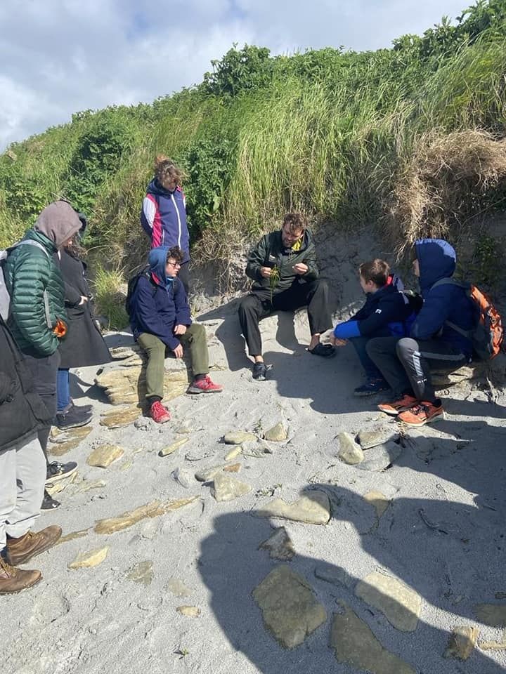 EE 30 Under 30 Joe explains seagrass to a class from Sanday Community School during a fieldtrip and co-design session.