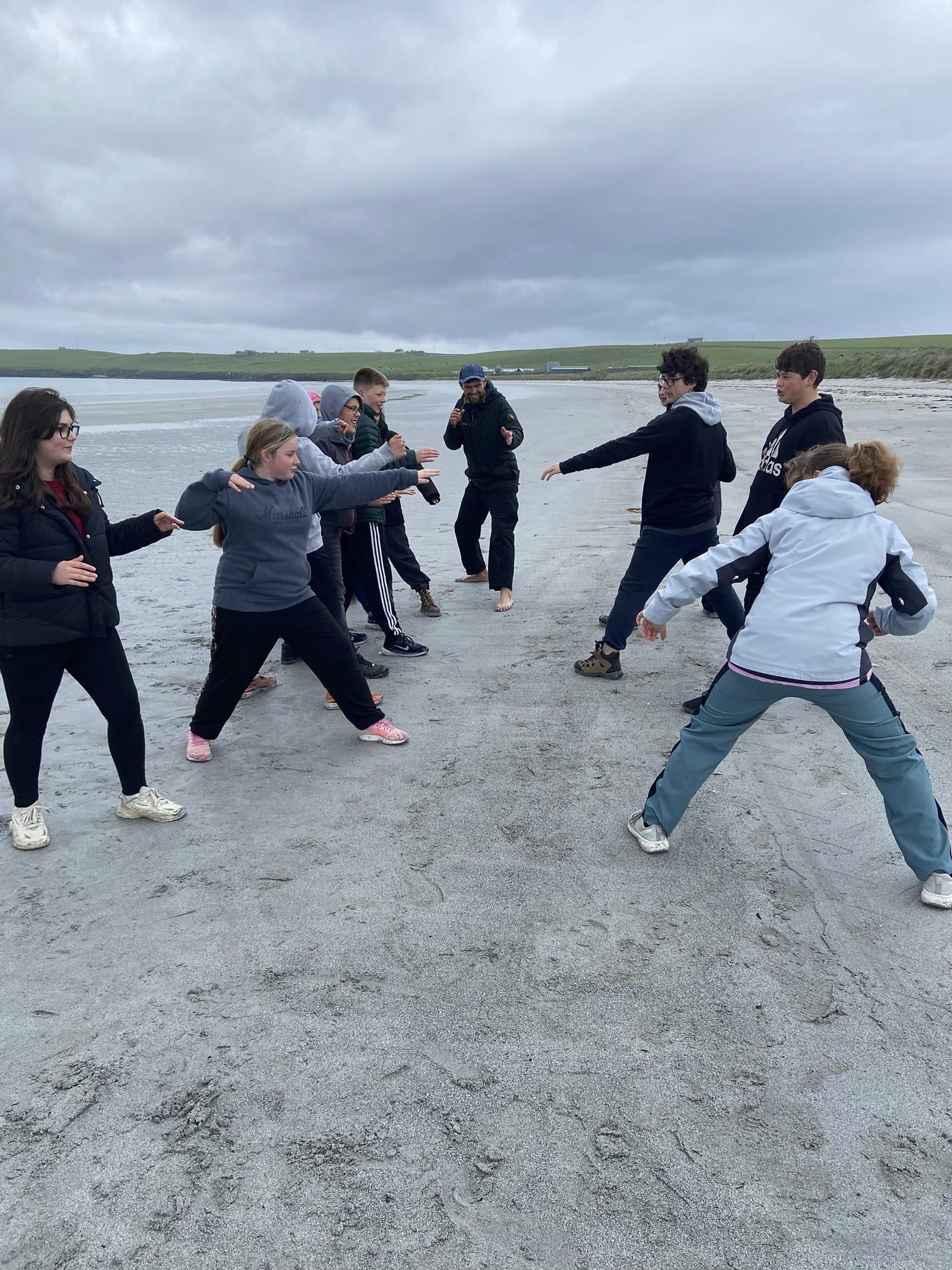 EE 30 Under 30 Awardee Joe leads an outdoor game with Sanday Community School