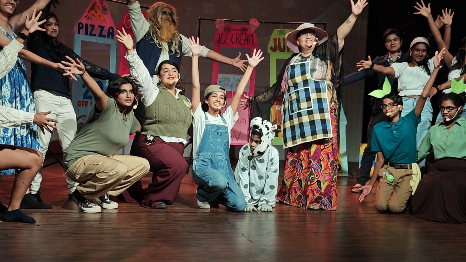 A group of performers on stage during a musical.