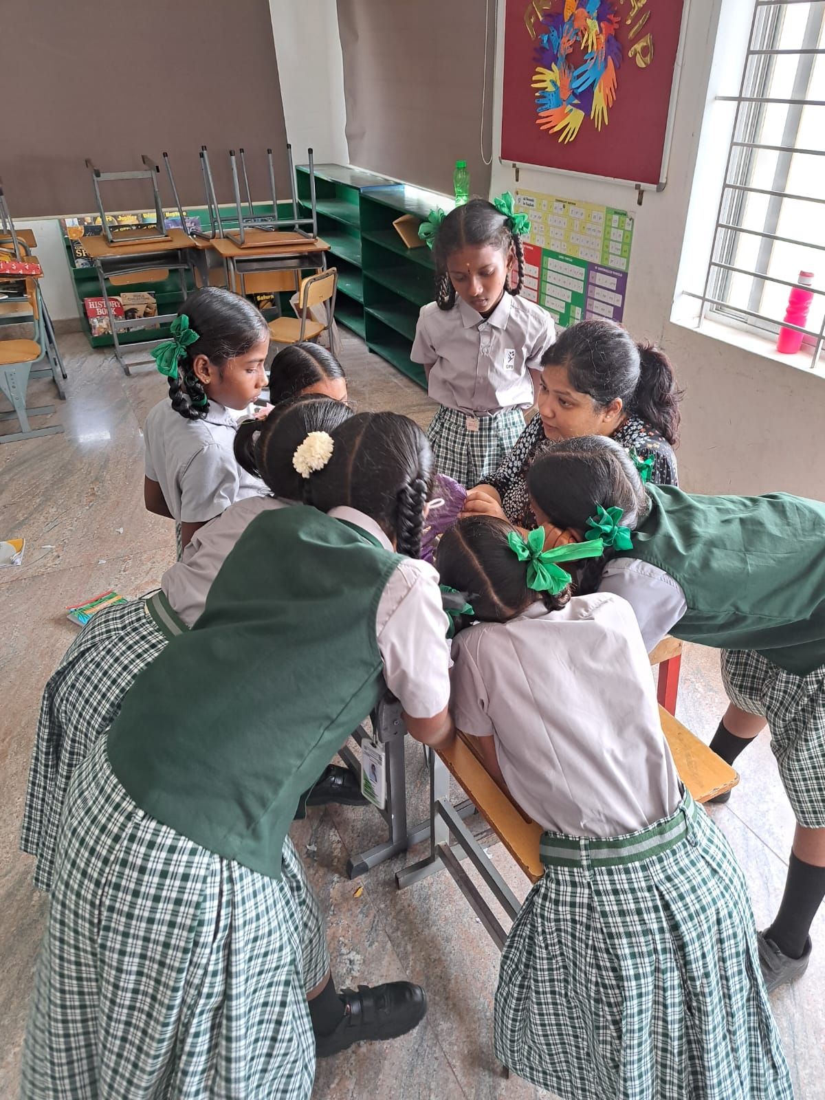Students in the classroom gathered around a table