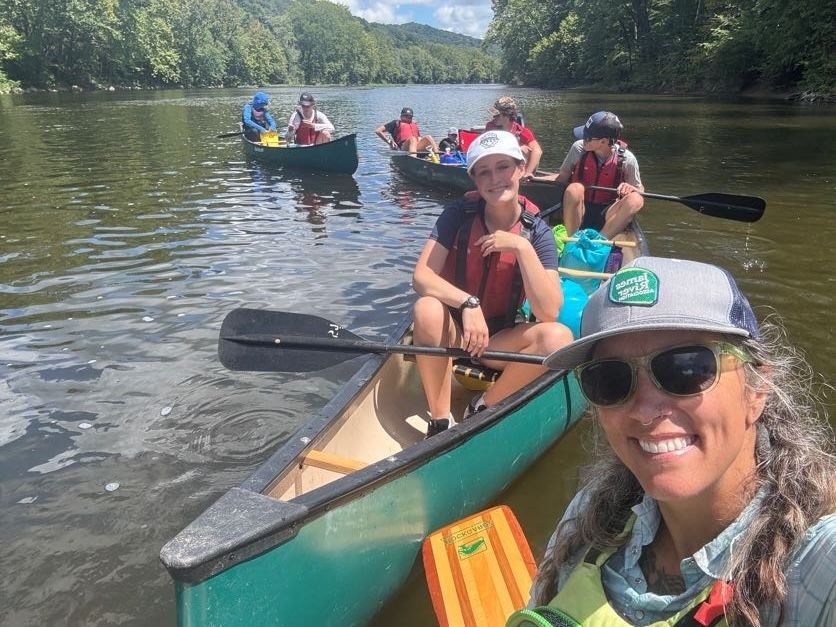 Teresa and students paddling on the water