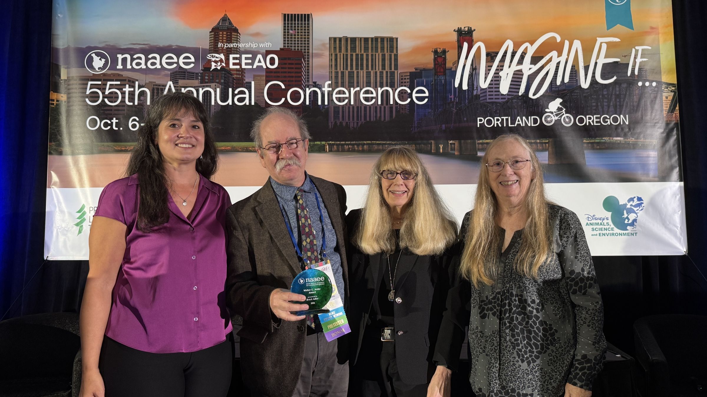 Brock accepts his award at NAAEE 2026!