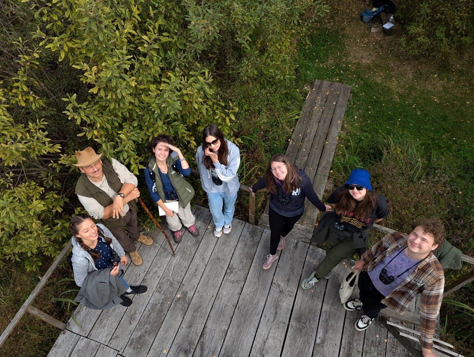 An aerial photo of a group of people in a nature park