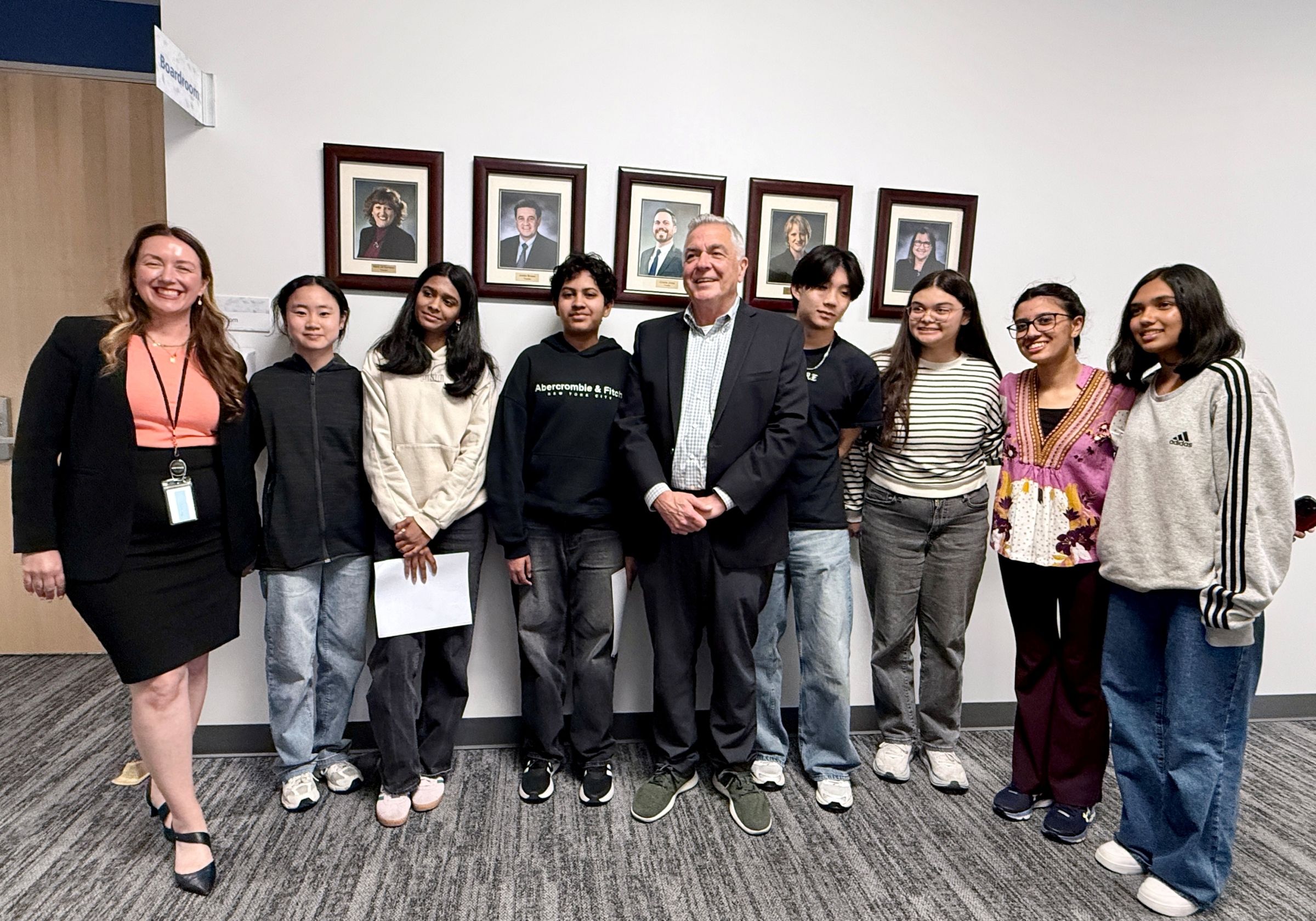 Pareena and a group of students posing for a photo