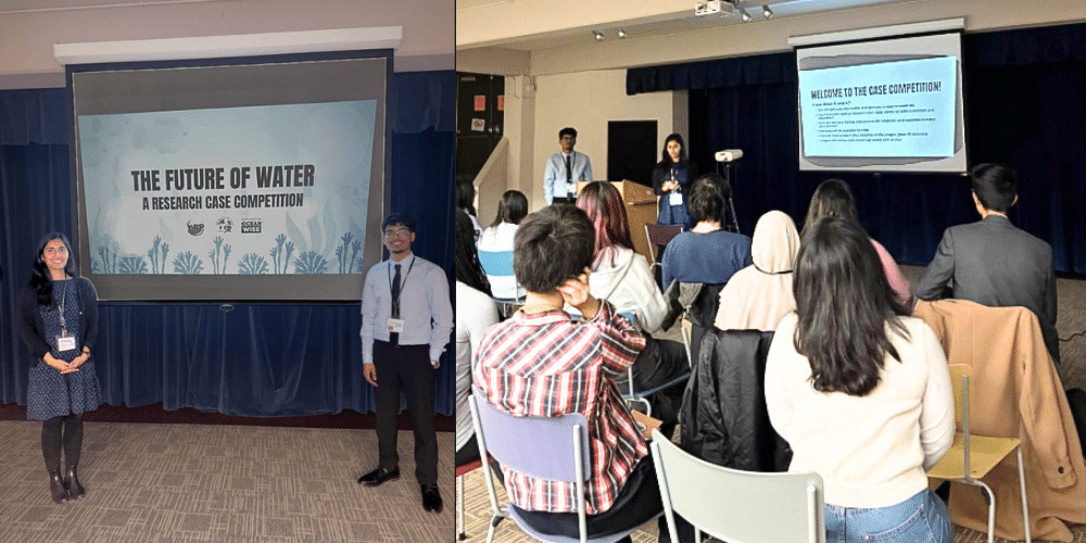 Shatabdy and a partner present in front of an audience
