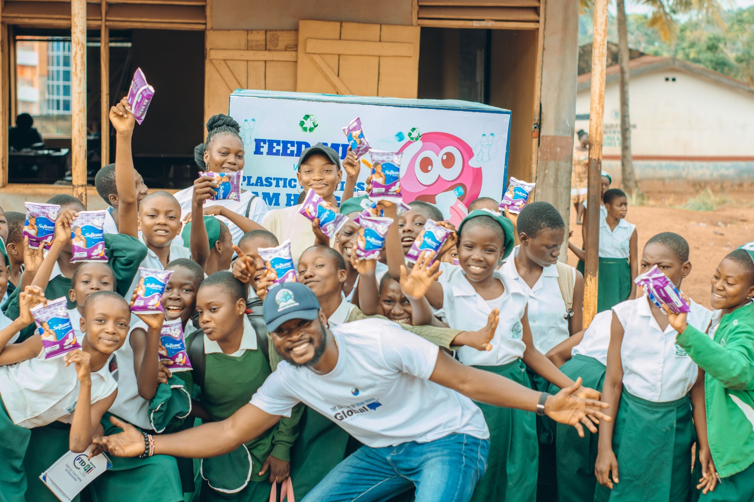 Solomon and a group of students pose for a photo outdoors