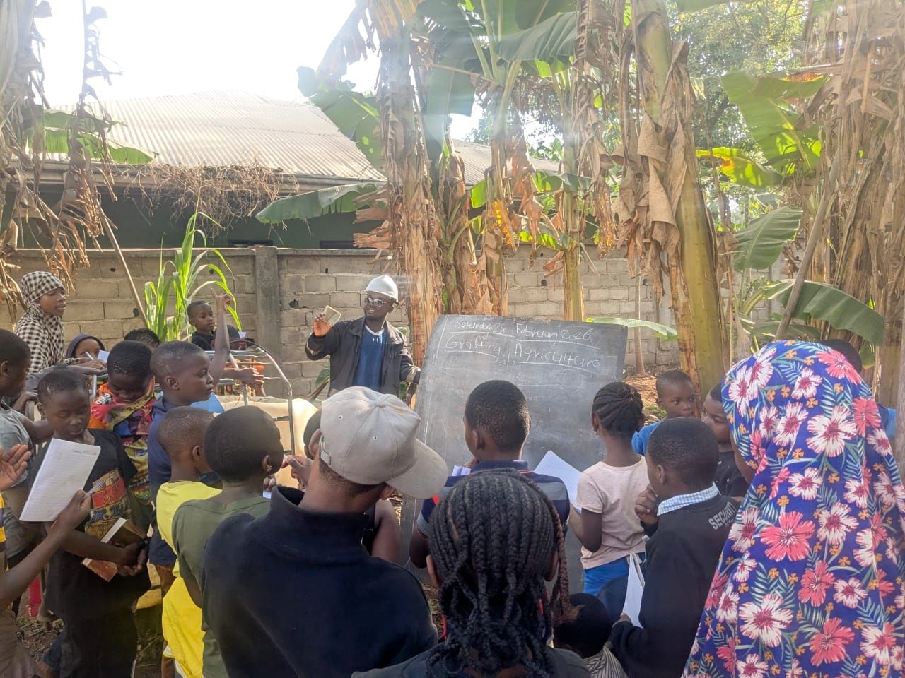 Warri Bilson leads a learning session for students in the garden 